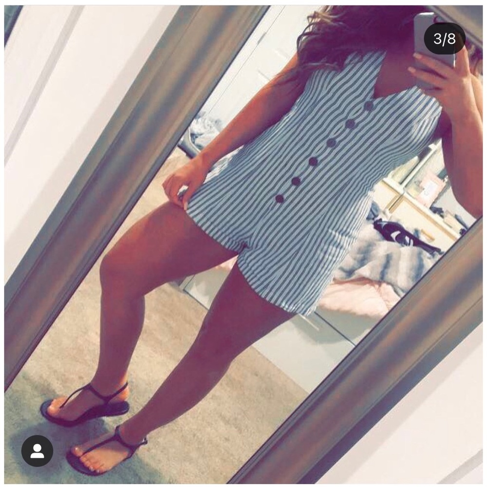 Stripped romper. Linen material. White with light black stripes.